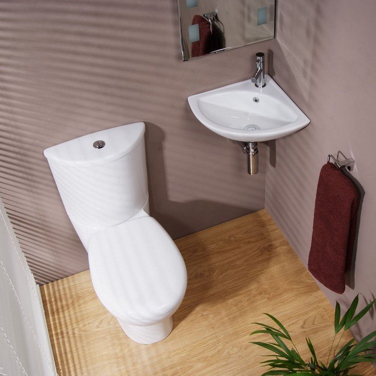 gäst-toalett-design-hörn-handfat-litet-badrum-kran-metall