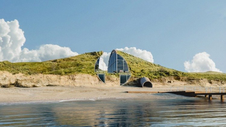 ett hus byggt på sanddynen med isolerade glasfönster hållbar design