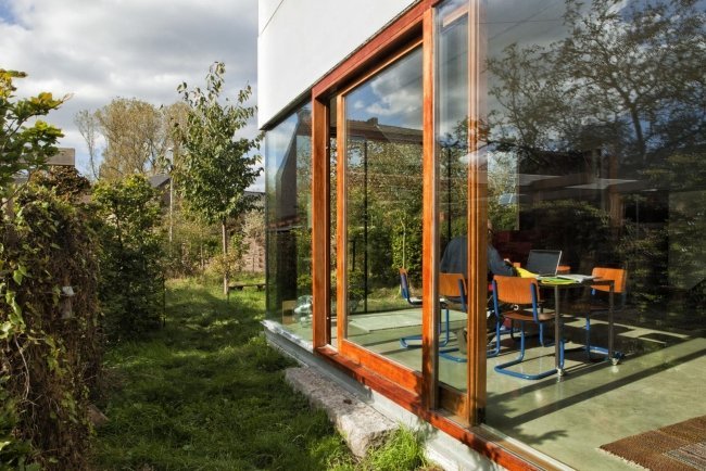 Skjutdörr glasvägg träkarmsglas Gepo-Haus Belgien