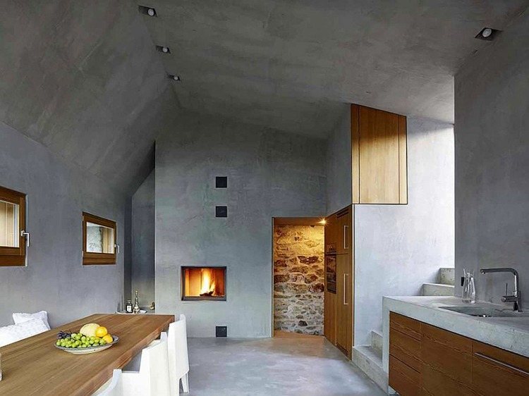 betong kök trä skåp öppen spis schweiz design