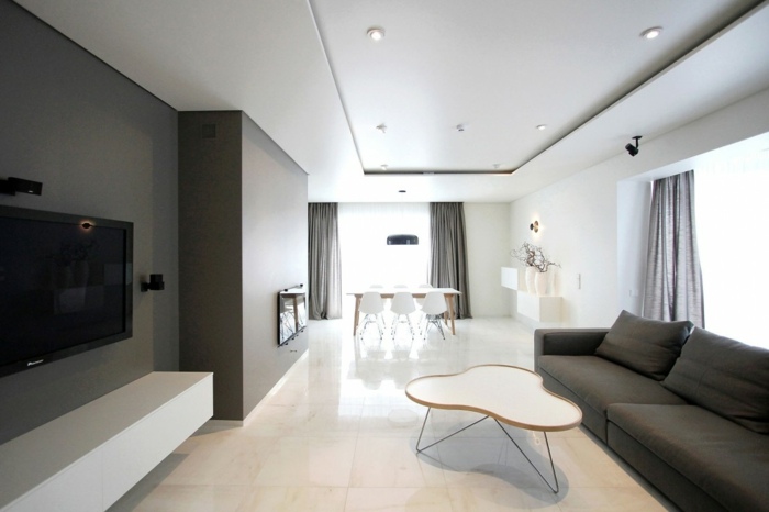 vardagsrum hus soffa soffbord lowboard högglans minimalistisk