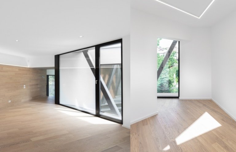 moderna inredningsrum med hörn och golvbrädor och fönster på golvnivå och vita väggar