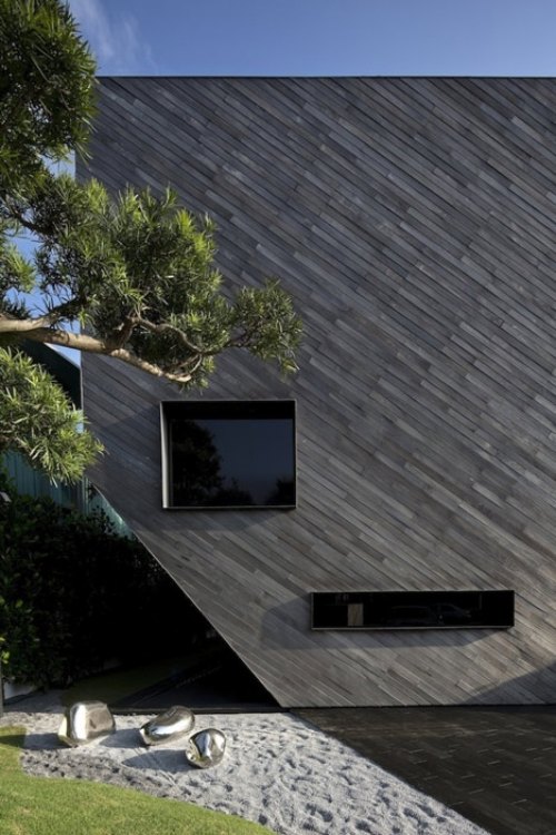 sidovy sten trädgård geometrisk husarkitektur av formwerkz