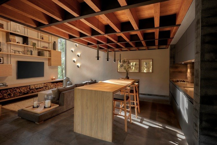 mysigt vardagsrum med tallbjälkar i taket och inbyggt kök