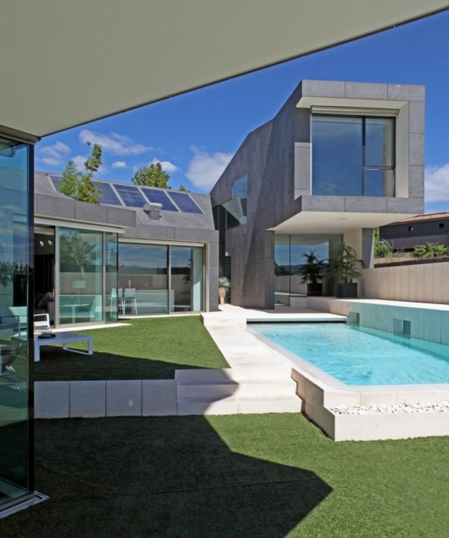 modern minimalistisk arkitektur pool stenstenar betongpool