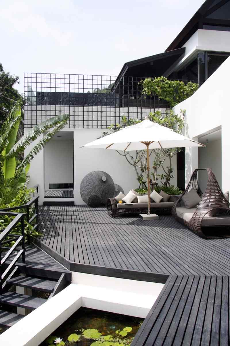 idéer-för-terrass-design-mysig-utomhus-lounge-område-rotting-soffa