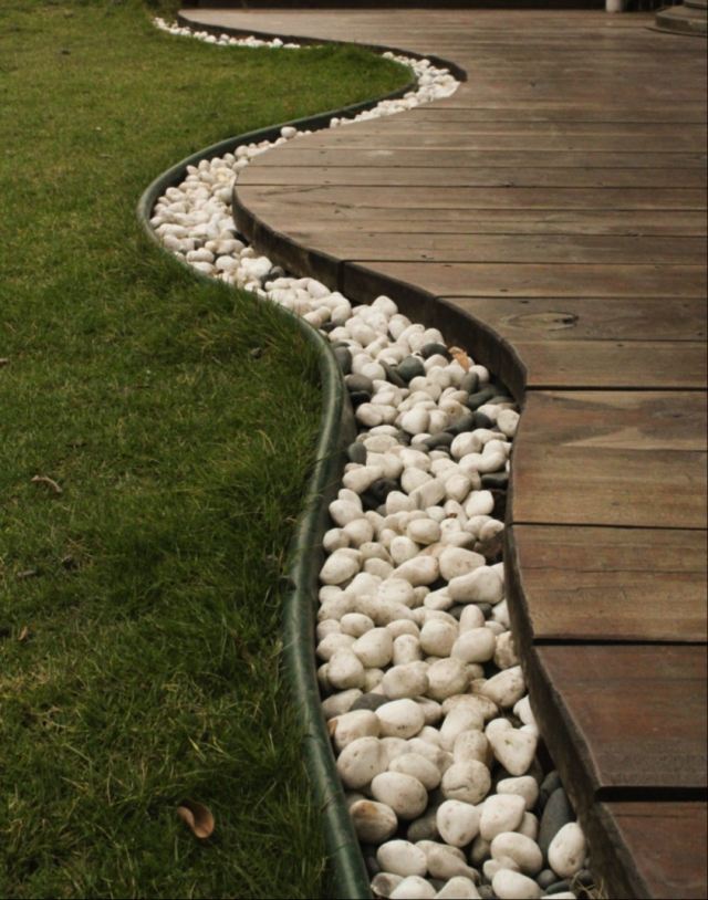 modern trädgård design sten terrass planka golv gräsmatta