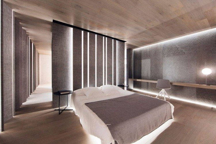 indirekt-belysning-vägg-design-säng-sovrum-trä-natursten