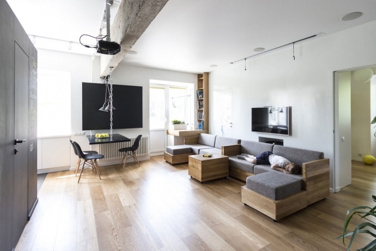 inomhus-lekplats-hem-vardagsrum-modulär-soffa-funktioner-hörnsoffa-matplats-trägolv-vägg-måla-vit