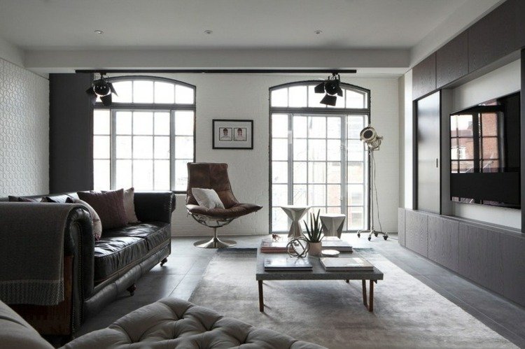 läder soffa elegant fåtölj soffbord gråbruna lampor industriell design