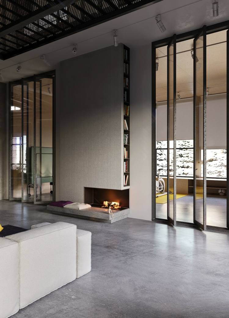 vardagsrum loft stil betonggolv öppen spis bokhylla glas stål skiljevägg