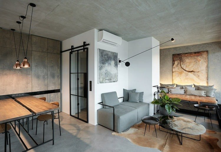 interiör industriell stil betong trä rustika möbler hängande lampor bild sittplatser
