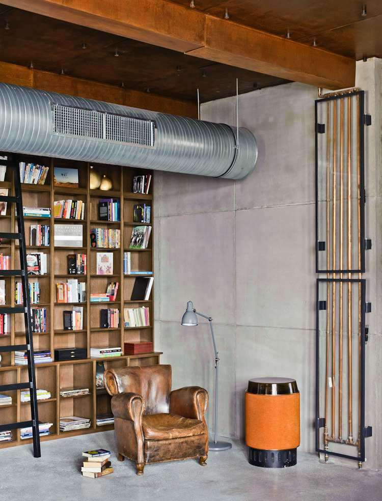 betongplattor vägggolv bibliotek rör rustika träbjälkar dekoration industriell stil