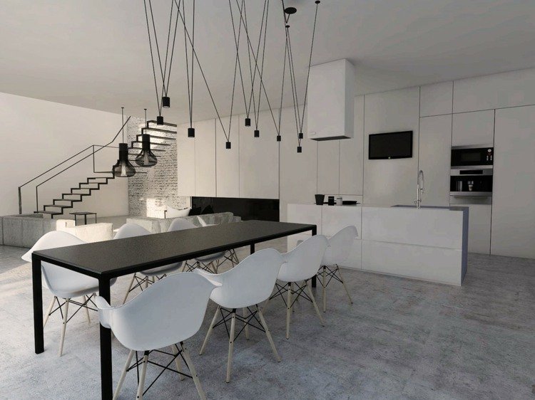 svartvitt kök hängande lampor ljuskrona industriell stil betonggolv trappor stål