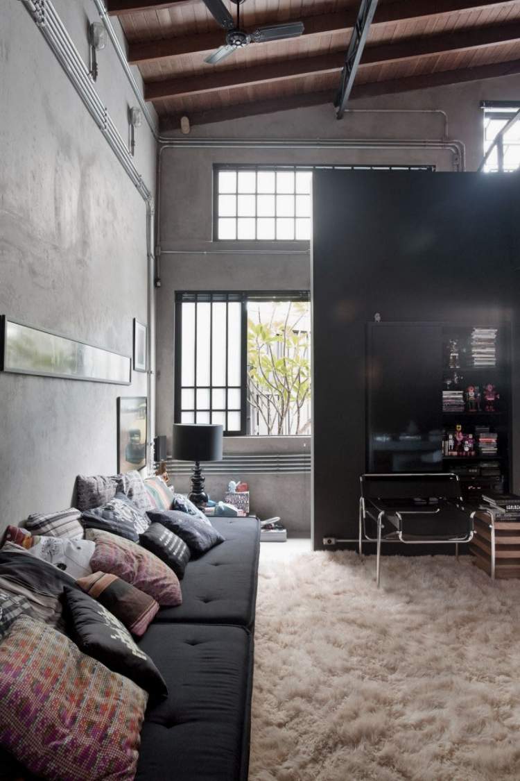 industriell design-möbler-svart-kudde-matta-mjuk-gitter-fönster-ljus