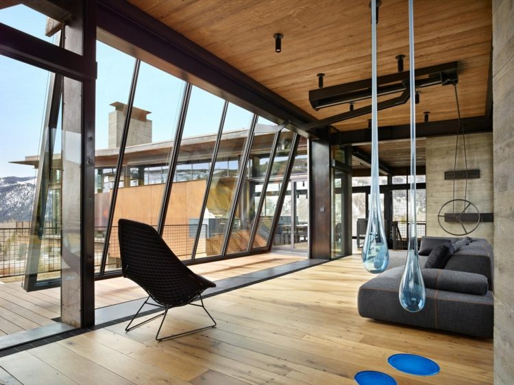 möbler i industriell stil sittgrupp-grå-soffa-pendel-dekoration-blå-accenter