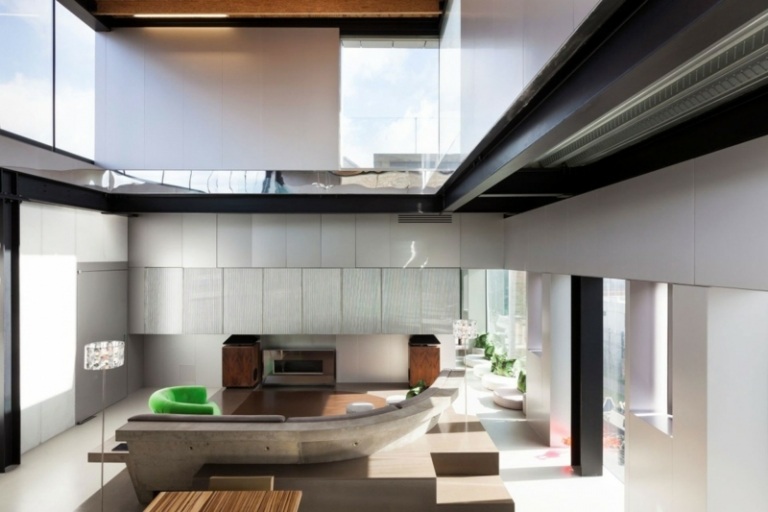 interiör gjord av betong och aluminium urban inredning london rund soffa