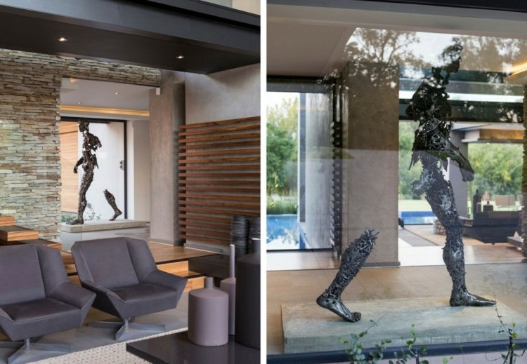 interiör av naturmaterial möbler fåtölj svart skulptur modern