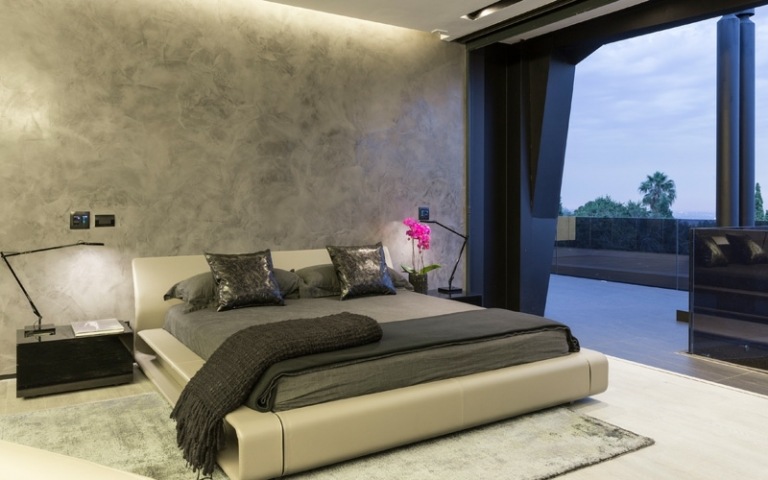 interiör golv betong vägg design ljus grå säng design sängbord