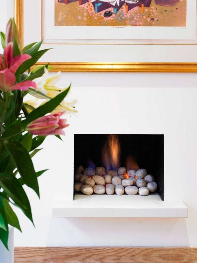 gas spis modern vardagsrum dekorativa stenar flamma
