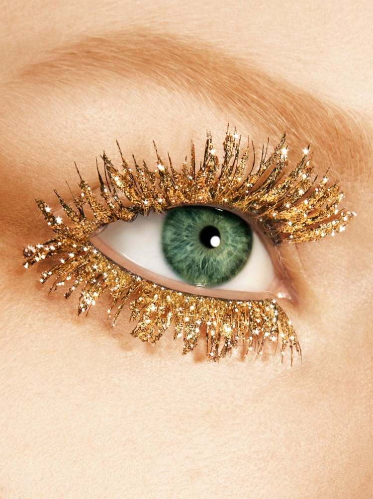 gyllene ögonfransar karnevalsmink glitter kvinna