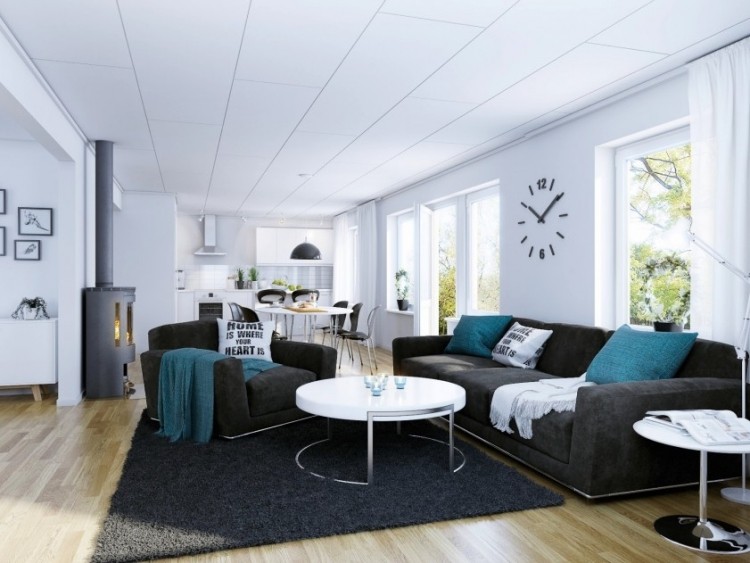 kudde-turkos-vardagsrum-modern-sittplatser-grå-soffbord-rund-vit-väggklocka