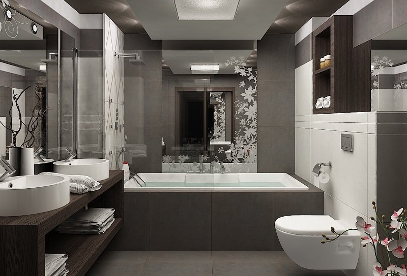 Litet badrum grå väggplattor badkar väggmonterad toalett