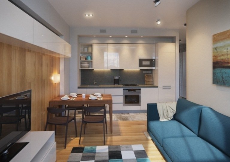 vardagsrum-kök-enkelrad-högglans-vit-grå-bänkskiva-trä-matbord-blå-soffa
