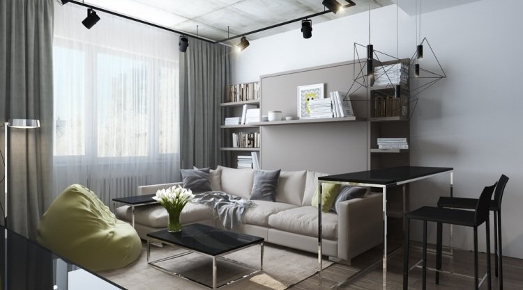 Inred en liten lägenhet -30kvm-soffa-ljusa-industriella-design-spotlights