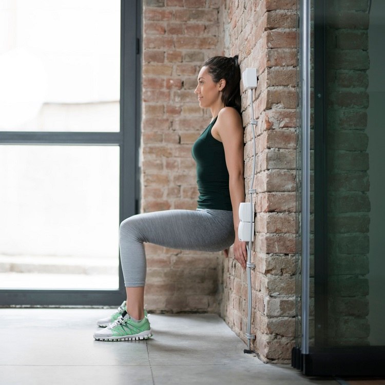 Väggstol tränings exekvering squat varianter utan vikter