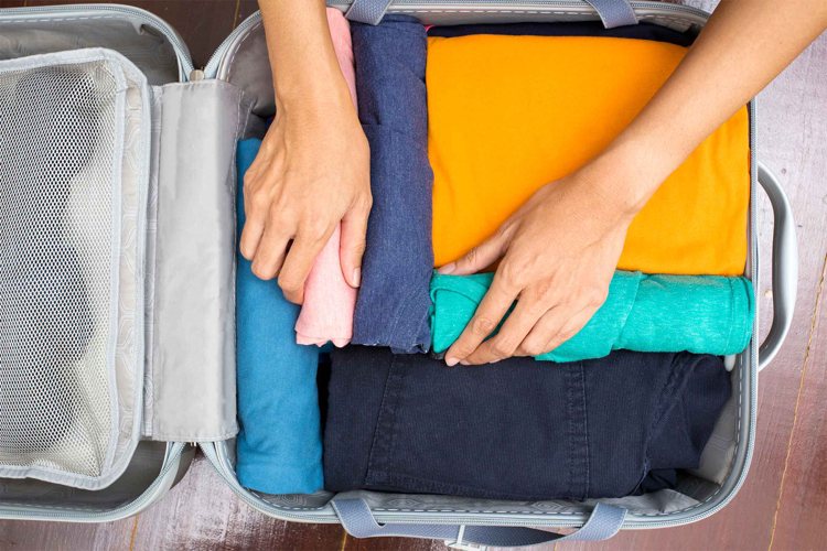 Packa din resväska checklista-tips-sortering-rulla-upp-kläder