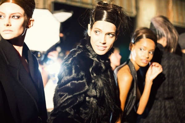 Modeller-backstage-pinned-up-hair-coat-Donna-Karan