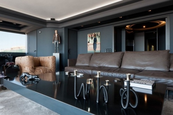 modern lägenhet läder vardagsrum möbler ljusstake soffbord
