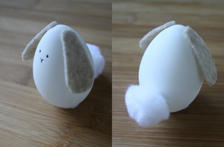 rolig-påsk-ägg-design-kanin-kanin-svans-pompon-vit