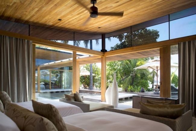 Luxury Resort Coco Prive Island Maldiverna sovrum öppen planlösning