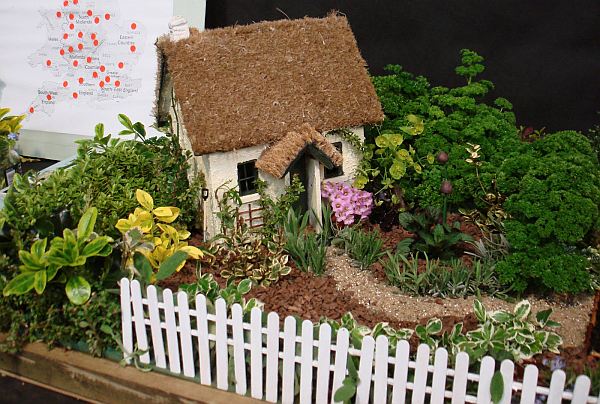 Miniatyrträdgårdar planters hus staketstaket vitt