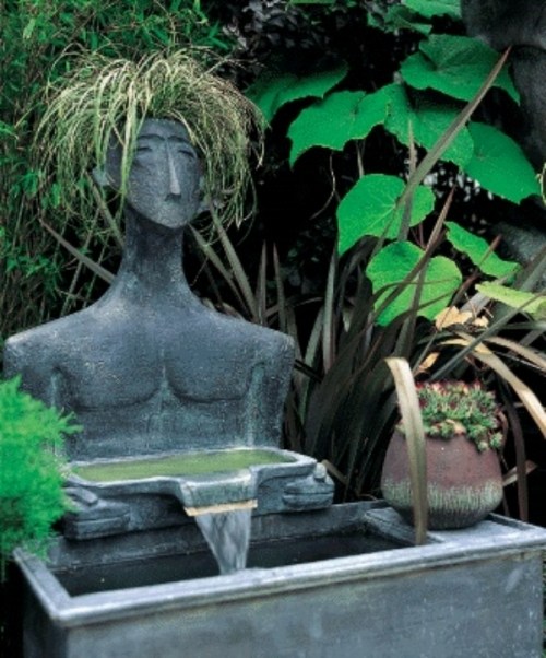mänsklig figur minimalism i designerträdgårdens fontän