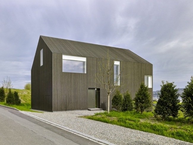 modern arkitektur minimalistiskt hus trä vid sjön zurichsee