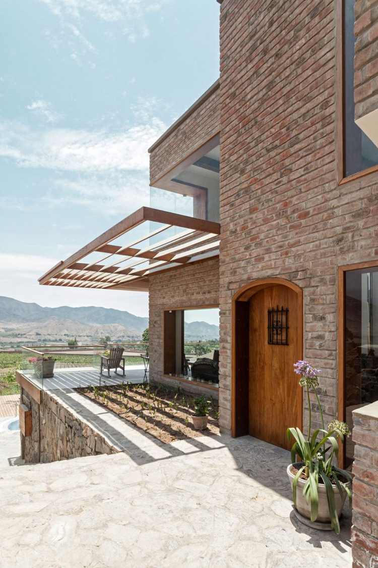 modern-konstruktion-tegel-hus-trädgård-terrass-hus-dörr
