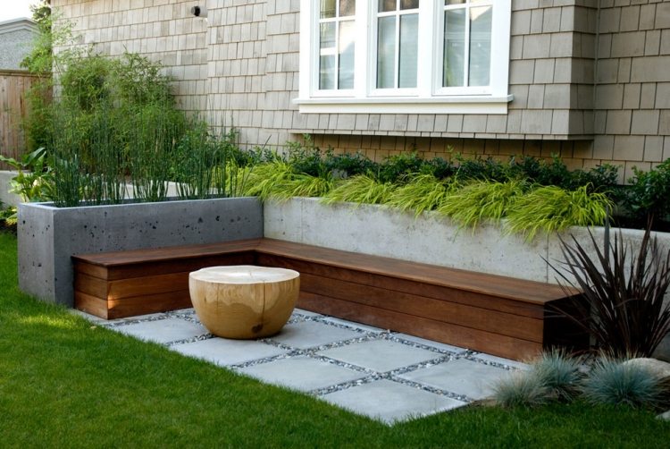 Modern trädgårdsdesign 2015-träbänk-betonghöjda sängar-prydnadsgräs-massivt trä-soffbord