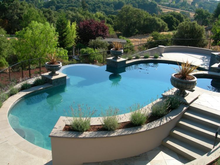 Moderna trädgårdsdesign-stenar-pool-terrasshöjda sängar