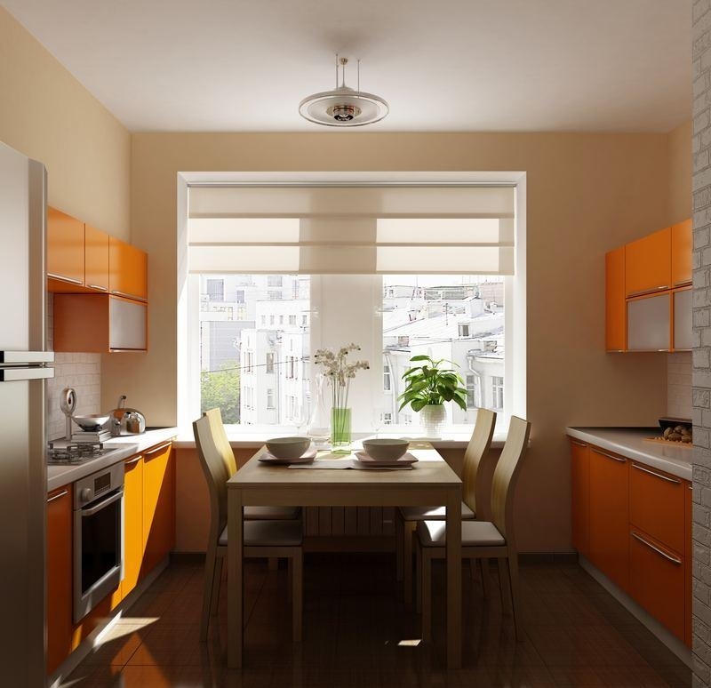 litet-kök-två-rader-matplats-orange-fronter-beige-vägg-färger