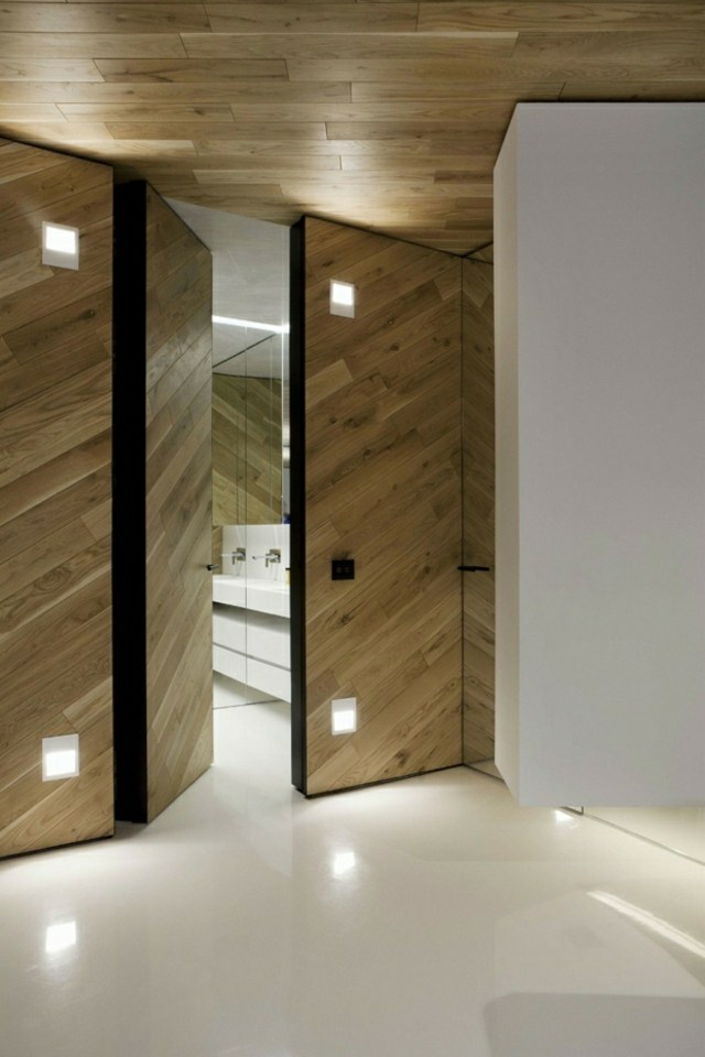 modernt badrum vita badrumsmöbler betonggolv