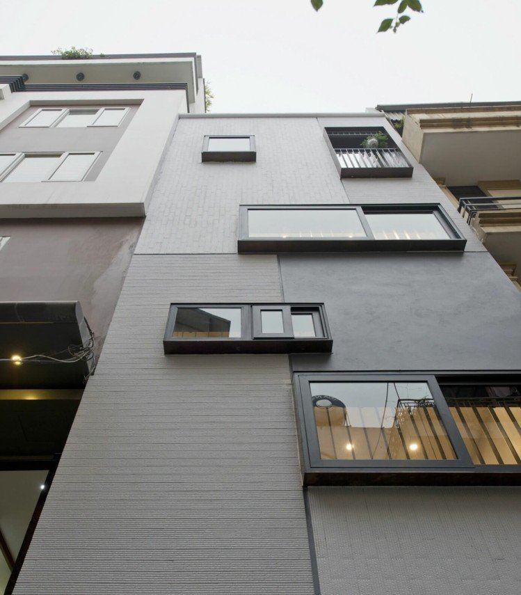 Modernt-rum-avdelare-radhus-front-fönster-betong-fasad