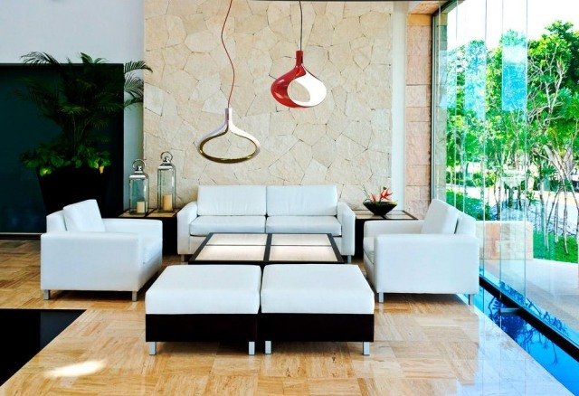 Designer hängande ljus lyser försiktigt moderna vardagsrumsmöbler