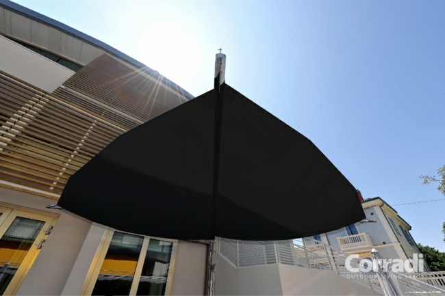 rullbar parasoll blad form svart färg cafe ingång