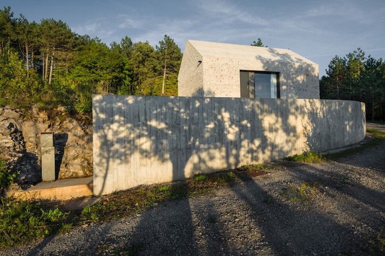 modern sten fasad minimalistisk hus sluttning egendom
