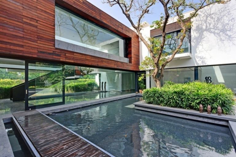 modern terrass design pool-buske-träd-trä-trädgård stig