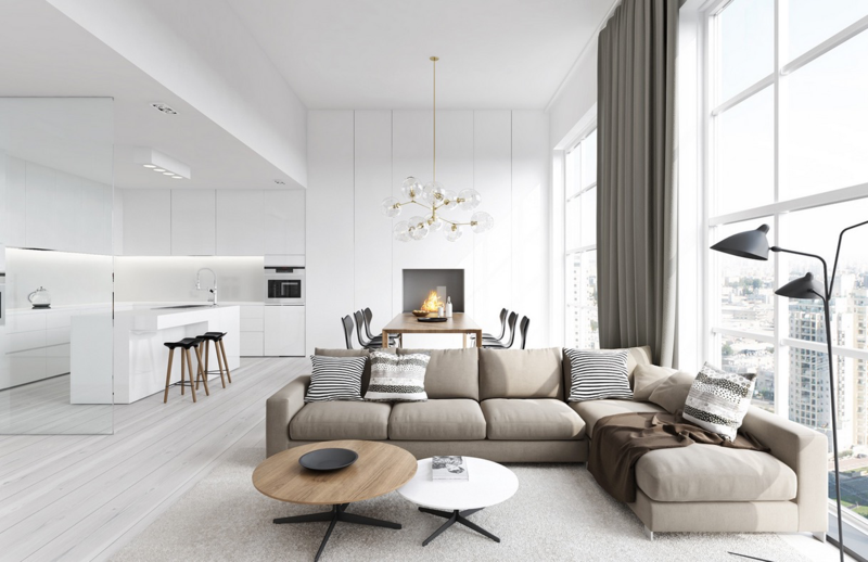 vardagsrum modern beige framför grått kök vit högblank spis
