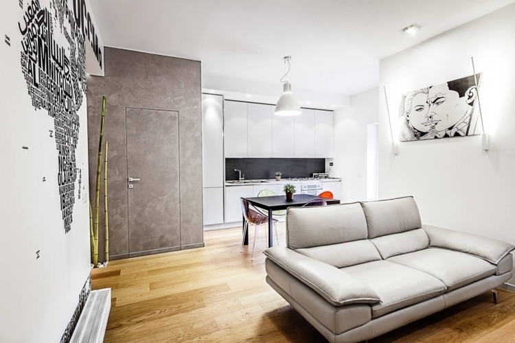 Väggdesign i svart och vitt-vardagsrum-popart-bild-soffa-grått trägolv-modern-ungdomlig